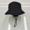 Detail view of a black quick-dry waterproof bucket hat with an adjustable chin strap. - M (56-58cm) / Bucket Hat / Black