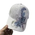 Elegant white lace baseball cap featuring blue floral embroidery and pearl details - One Size (Adjustable) / White (Blue/Purple Flowers)