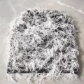 Handmade shaggy knit beanie hat in black and white for cozy winter outdoor warmth - One Size / Black Background White