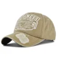 Detailed macro view of 3D embroidered 86 patch and vintage print on washed baseball cap - 55-60cm / Khaki