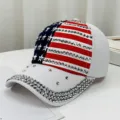 Detailed view of the US flag themed baseball cap featuring sparkling rhinestone embellishments - White