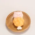 Adorable pink pig character hugging a crispy fried chicken drumstick ornament on a wooden plate - Pink (Pig Chicken Leg)