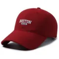 Close-up view of a burgundy baseball cap with white Boston 1630 embroidery details. - 55-60cm Head Circumference / Burgundy