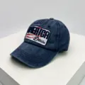 Detailansicht einer Vintage-Baseballkappe aus gewaschenem Denim mit großem Amerika-Stickpatch - 55-60cm / Marineblau