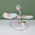Detailed view of 3-tier heart shaped dessert display stand for afternoon tea scene. - 3-Tier Large Heart White Plates with Gold Rim and Pink Butterfly Rod