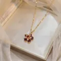Elegant close-up of a flower pendant necklace with red zircons in a white gift box - Multicolor-3 (X1590)