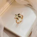 Gold starfish ring with black enamel and sparkling stones shown in a luxurious gift box - Starfish Enamel Ring (J0787)
