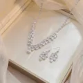 Close-up of sparkling zircon necklace and earrings set in a luxury cream jewelry box. - White Multi-Waterdrop Style (PJ--195)