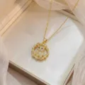 Detail view of gold plated necklace featuring a sparkling zircon encrusted bear pendant - Zirconia Micro-inlaid Bear Necklace (X0472)