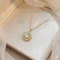 Golden sunflower pendant necklace with white zircons presented in an elegant jewelry box - Flower Necklace (X0987)