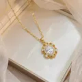 Elegant gold-tone necklace with an oval white zircon pendant in a scalloped halo setting. - Oval Floral Border Style (X0636)