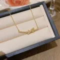 Κομψό χρυσό κολιέ φιόγκος από ατσάλι τιτανίου με ζιργκόν σε πολυτελές κουτί δώρου - X0212 Στυλ Κόμπος Φιόγκος / Χρυσό