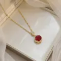 Elegant gold necklace featuring a round red zircon pendant with halo diamonds. - Red Round Gold Chain (X0437-1)