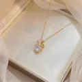 Collier pendentif noeud doré élégant avec pierre de zircone cubique claire - Style Papillon Doré (X0959)