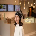 Asian model wearing a stylish black cashmere-like slouchy beanie with cursive patterns. - English stripe black / Adjustable