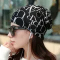 Black cashmere-like slouchy beanie with white letter print worn by an Asian model - S letter black embroidered white / Adjustable