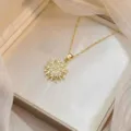 Detailed view of a gold snowflake necklace pendant with sparkling cubic zirconia - Snowflake Pendant Clavicle Chain (X0866)