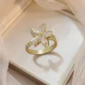 Elegant gold-toned starfish ring with white inlay and clear cubic zirconia stones - Starfish Shell Ring (J0786)
