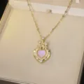 Elegant gold-tone heart necklace with castle design and pink iridescent stone - Castle Iridescent Heart Style (X0368-2)