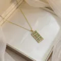 Elegant gold-plated necklace featuring a rectangular emerald green zirconia stone pendant - Light Green Rectangular Pendant (X0451-3)