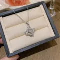 Elegant star pendant necklace with pavé zircons displayed in a black jewelry box - X0271-2 Silver Layered Zirconia Star Necklace / Silver