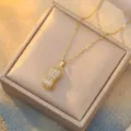 Elegant gold peanut pendant necklace with sparkling stones and bamboo chain design - Gold Peanut Style (X0013)