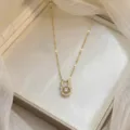 Elegant gold reindeer necklace with a sparkling dancing cubic zirconia stone pendant - Reindeer Style Round White Zirconia (X0497--1)