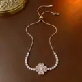Verstellbares Armband in Roségold mit rotierendem Zirkonia-Glücksklee-Blütenanhänger - Armband (TS0083) / Roségold
