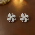 Elegante, um 360 Grad drehbare Windrad-Ohrstecker aus Silber mit Zirkonia-Steinen - Ohrstecker (E0002) / Stahlfarben