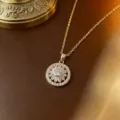 Elegante goldene rotierende Blumen-Halskette mit funkelnden klaren Zirkonia-Steinen - Halskette (X0042) / Gold