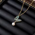 Gold-plated titanium steel butterfly pendant necklace featuring green inlay and white pearl - Green Wing Butterfly Style (X0109)