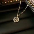 Luxury gold-plated stainless steel necklace with Fu character and sparkling crystal pendant - Round Fortune Character Style (X0121)