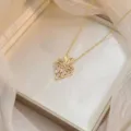 Gold-plated titanium heart necklace featuring elegant baguette-cut zircon inlay detail - Heart Necklace (X0741)