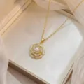 Gold plated camellia flower necklace featuring a central pearl and micro zircon pave setting. - Gold Micro-Inlaid Zirconia Artificial Pearl Camellia Necklace (X0807)
