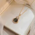 Elegant gold titanium steel necklace with flower pendant and deep tone gemstone detail - Dark Gemstone Floral Style(X0784)