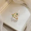 Elegant gold daisy ring with green and white zircon gemstones for a niche fashion look - Daisy Open Ring (J0230)