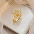 Elegant gold plated hollow flower ring with shimmering micro-set cubic zirconia stones - Gold Hollow Five-Petal Flower Micro-Inlaid Zirconia Ring (J1213)