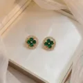 Elegant gold-plated stud earrings with green clover flower and zircon halo - Emerald Rotating Earrings (E0284) / Gold