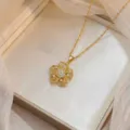 Elegant gold-plated flower pendant necklace adorned with shimmering micro-set cubic zirconia - Gold Micro-Inlaid Zirconia Hollow Flower Necklace (X0218)
