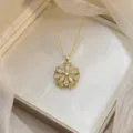 Elegant gold-tone necklace featuring a detailed and sparkling zircon flower pendant - Hollow Floral Necklace (X0600)