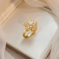 Elegant gold-plated flower ring with a pearl center and sparkling zircon petals - Five-Petal Flower Pearl Ring (J0651)