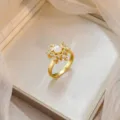 Elegant 18k gold plated flower ring with central pearl and micro-pave zirconia - Snowflake Pearl Micro-inlaid Ring (J1207)