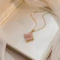 Elegant gold titanium steel necklace with a rotating pink zircon bauhinia flower pendant - Bauhinia Rotating Necklace (X0743) / Gold Pink