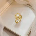 Elegant gold-plated flower ring with micro-pave cubic zirconia and clear center stone - Micro-pave Eight-Petal Flower Ring (J0777)