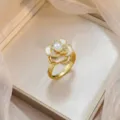 Elegant gold-plated flower ring with pearl and micro-set zircons for a luxury look. - Camellia Pearl Micro-pave Ring (J0795)