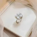 Elegant flower ring featuring four white pearls and micro-paved zircon cross detail - Four-Pearl Cross Zirconia Ring (J0798)