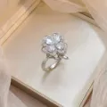 Exquisite silver-tone ring with micro-pave zircon flower design in jewelry box - Micro-pave Zirconia Four-leaf Clover Ring (J1214)