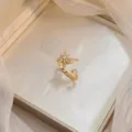 Golden rotating flower ring with sparkling zircons, elegant open adjustable band - Butterfly Rotating Ring (J0253) / Gold