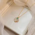 Rotating flower necklace with purple and green zircons in gold-tone titanium steel - Rotatable Heart Necklace (X1350) / Gold