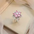 Elegant pink zircon flower ring with silver finish in a luxury gift box setting - Pink Teardrop Zirconia Flower Ring (J1217)